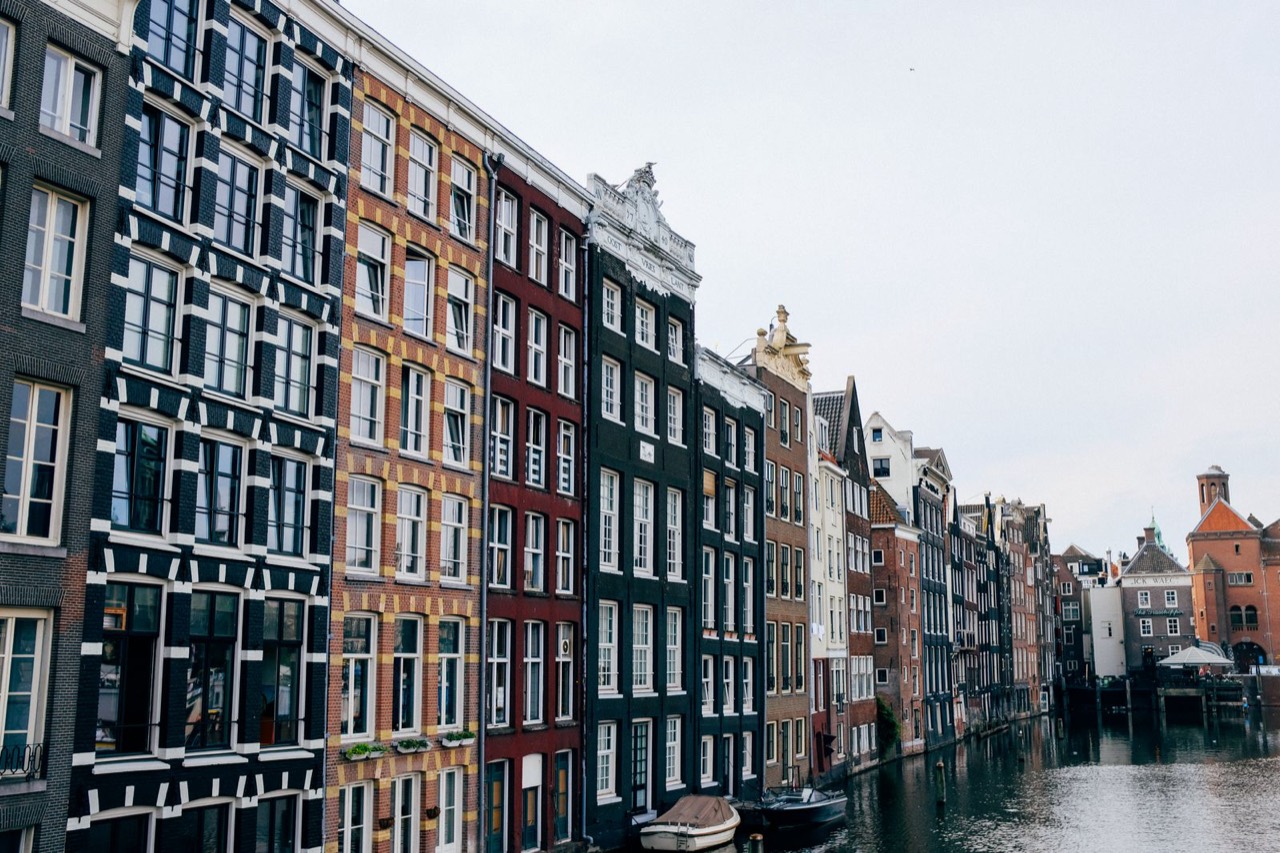 Colourful canal houses in Amsterdam, the backdrop to a sweet tooth's guide to the city, near Ruma